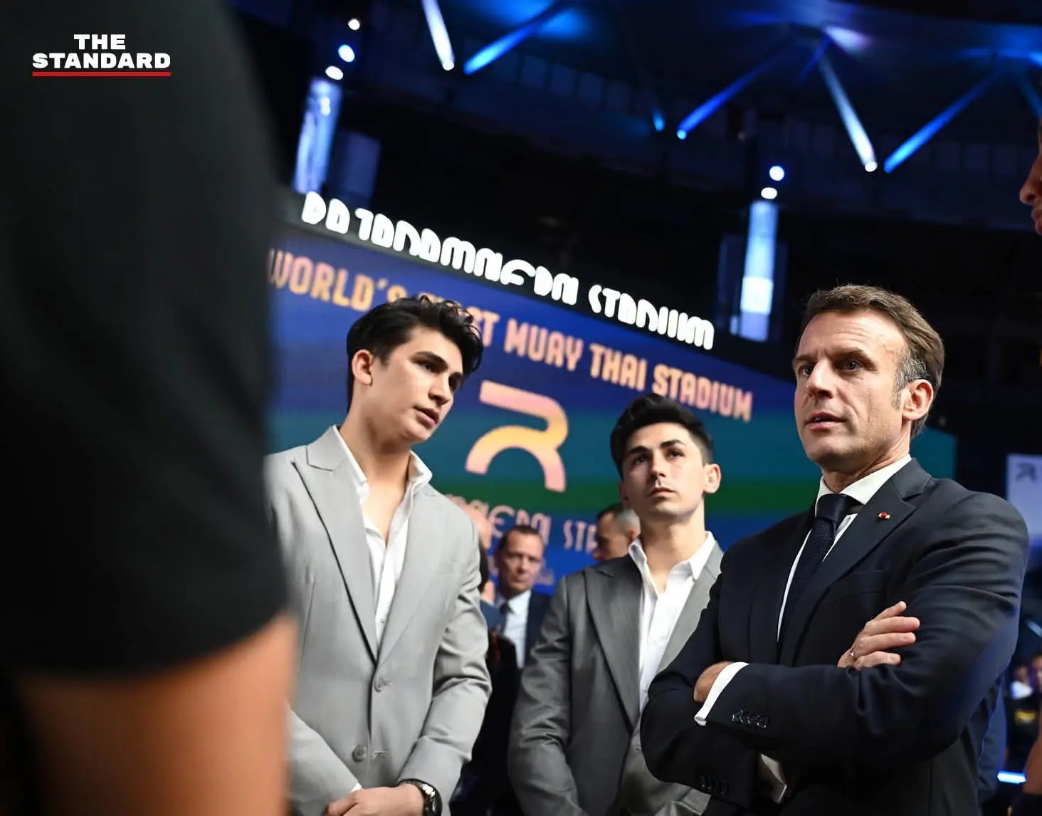 Antoine and Leo Pinto accompanying President Emmanuel Macron inside Rajadamnern Stadium