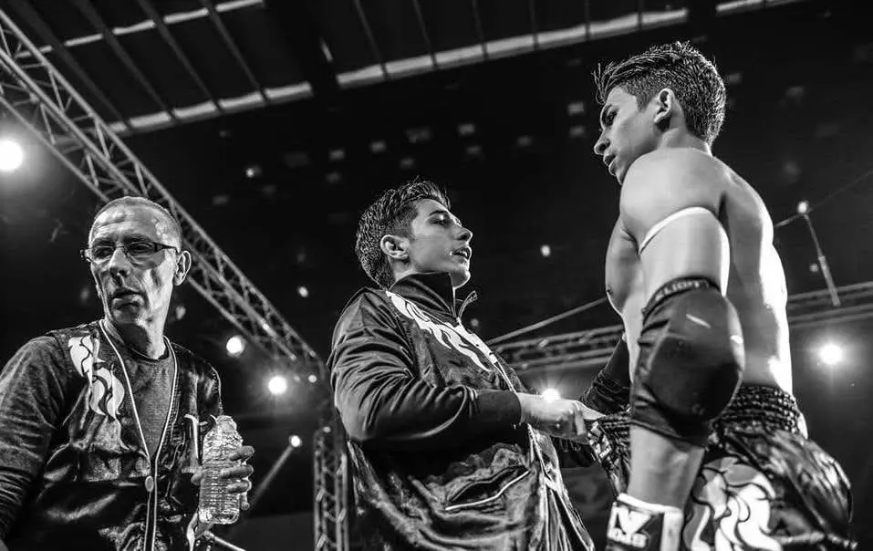 The Pinto family together in the corner at a combat sports event